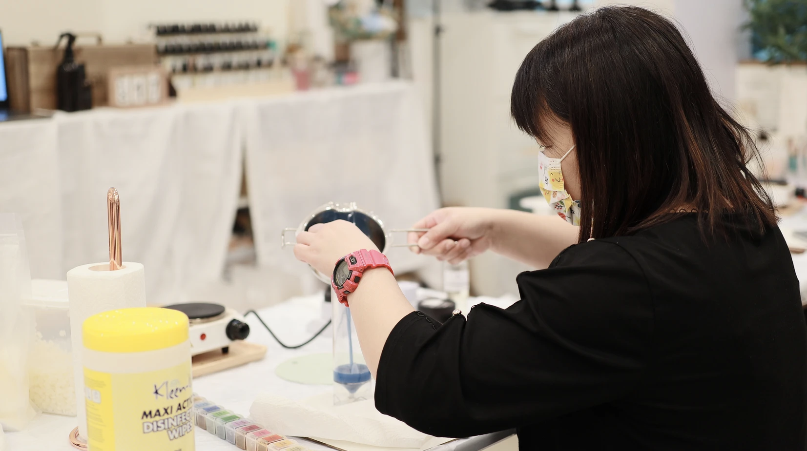 Woman doing candle making at Happy Together
