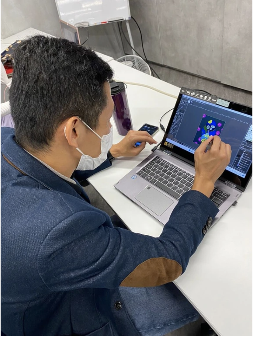 Student creating NFT digital art